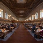 people reading quietly in a public library